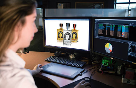 Photo of artworker at workstation