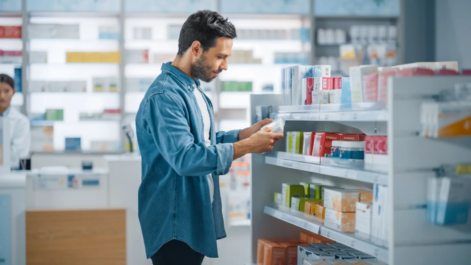 Man in pharmacy looking at products